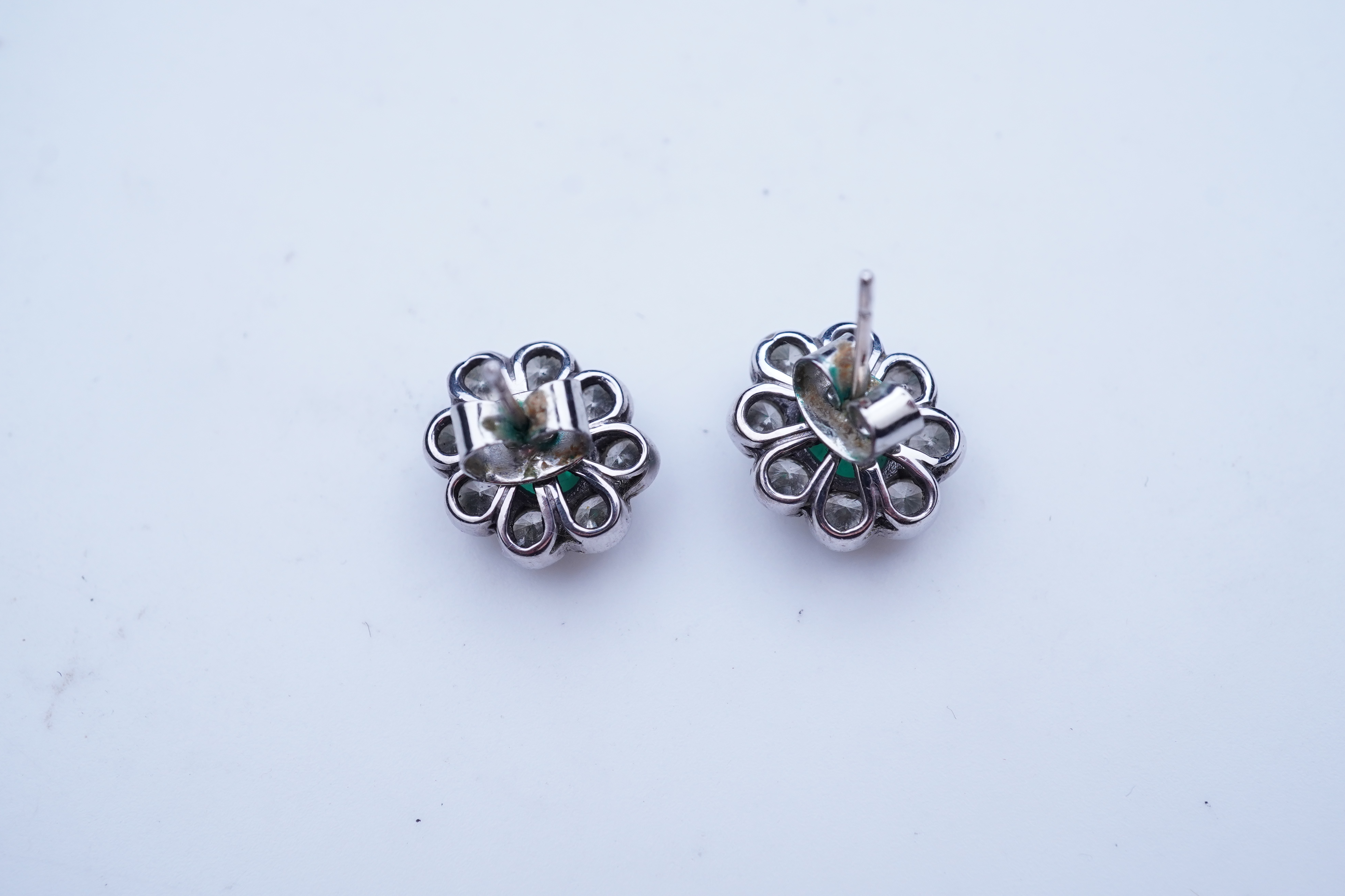 A pair of emerald and diamond earrings